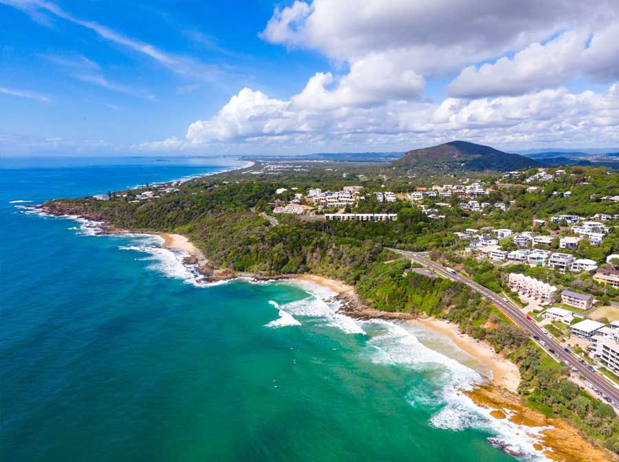 Aerial view of Coolum’s coastline and Mount Coolum on the Sunshine Coast