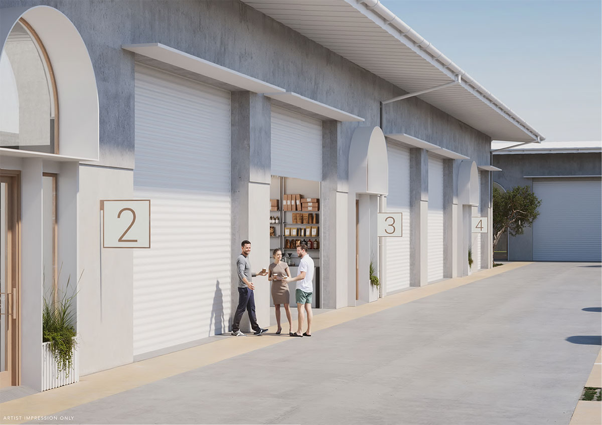 Atria workstores with arched pedestrian entries, bronze signs and high roller doors